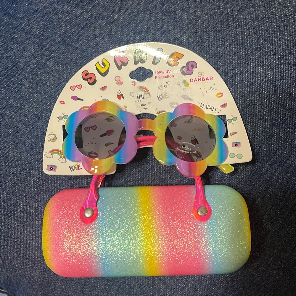 Sunglasses and case. Little girl. Few scratches on the frame. See pictures